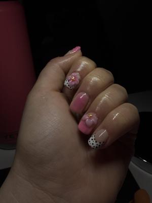 Pink nails with hand-painted 3D flowers and black dotted accents