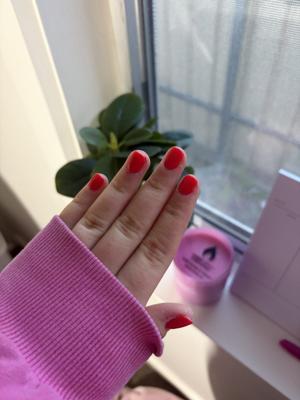 Short square nails in a glossy bright red