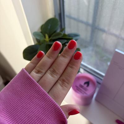 Short square nails in a glossy bright red