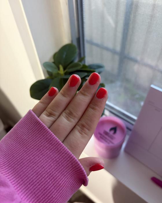 Short square nails in a glossy bright red